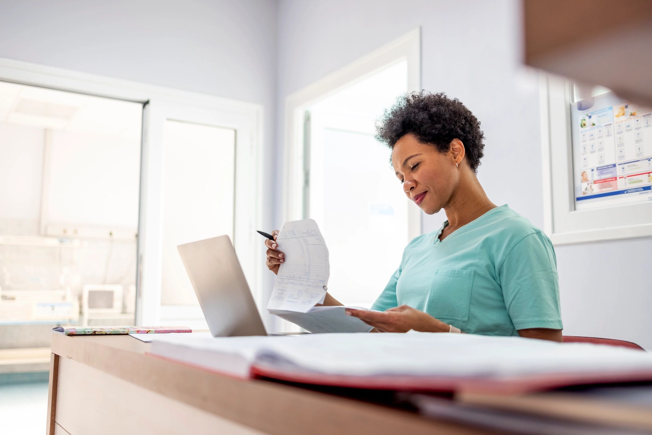 Medical professional reviewing mortgage paperwork