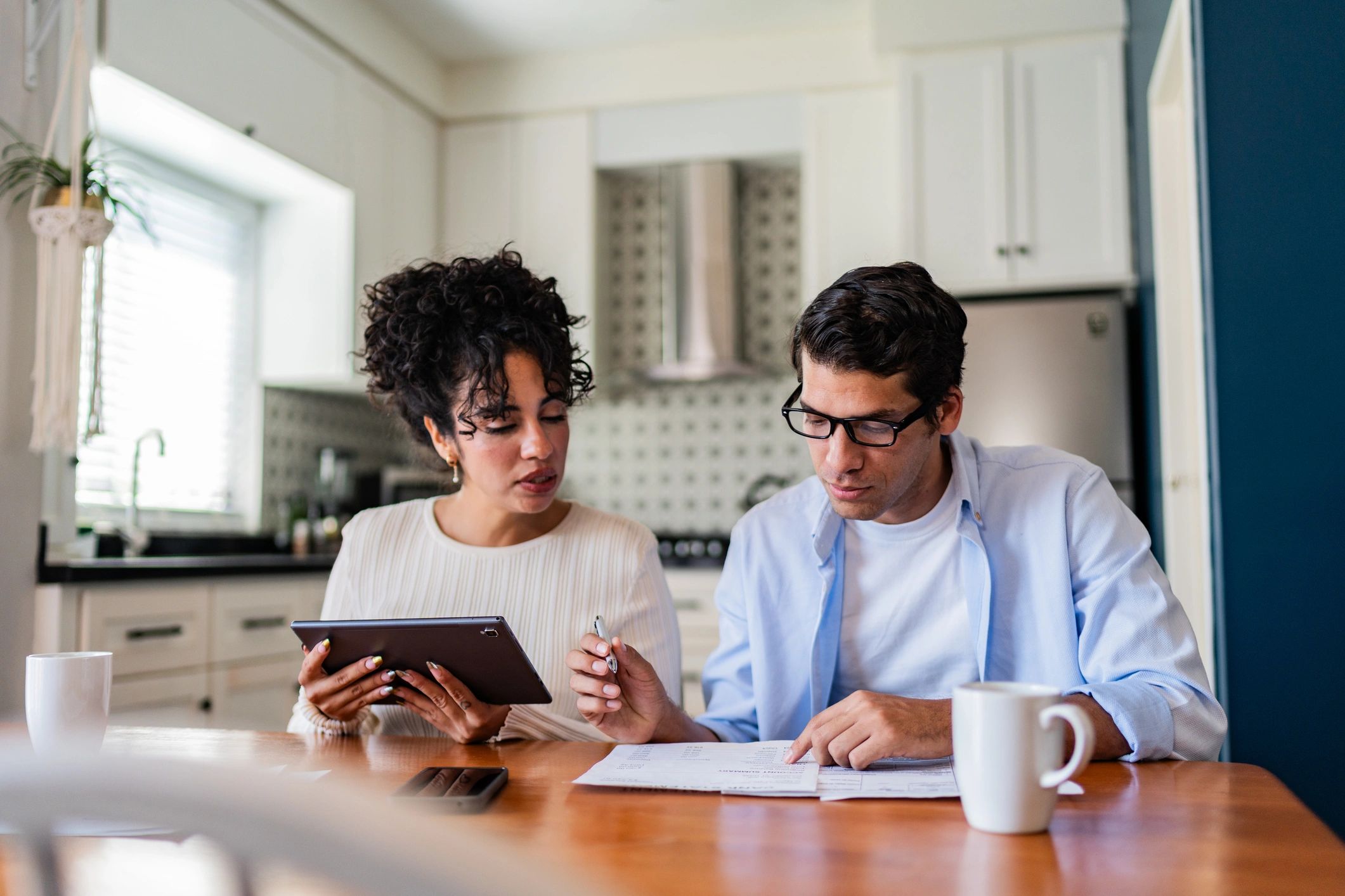 Couple reviewing home financing documents together